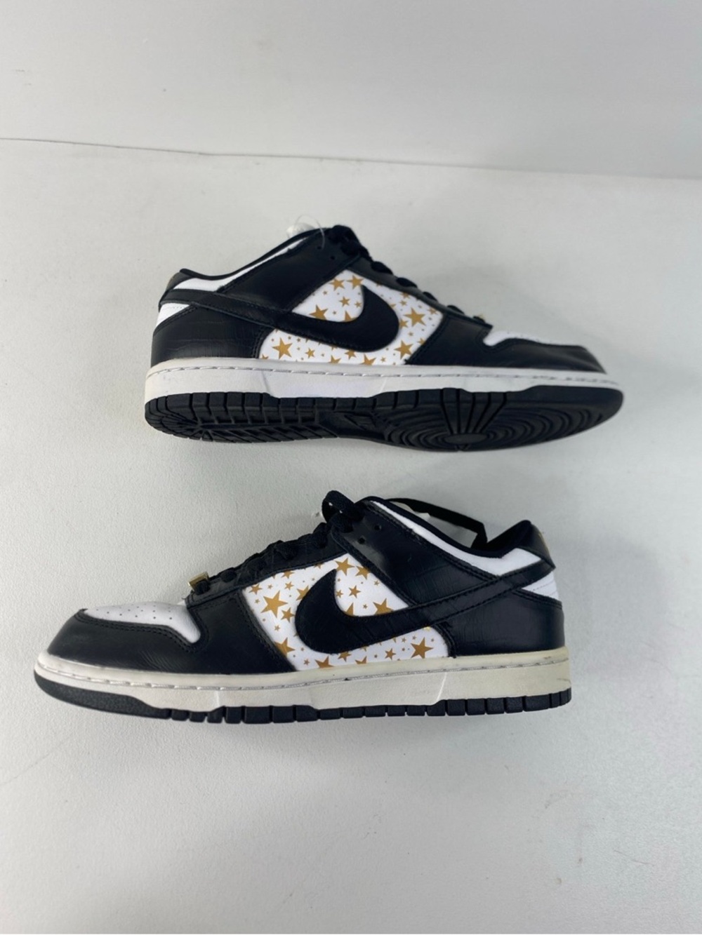 Nike Black & White Low-Top Sneakers with Gold Star Swoosh